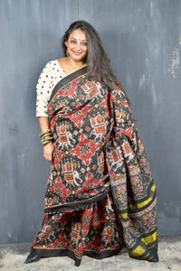 KUNJAR BHAT BLACK-FIRE BRICK RED SINGLE IKAT COTTON PATOLA SAREE WITH ZARI ANCHAL