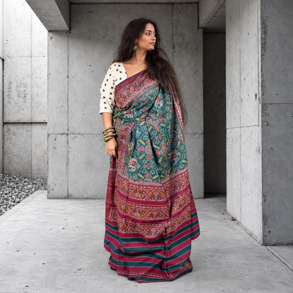 KUNJAR  BHAT CASTLETON GREEN-WINE RED SINGLE IKAT COTTON PATOLA SAREE