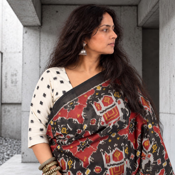 KUNJAR BHAT BLACK-FIRE BRICK RED SINGLE IKAT COTTON PATOLA SAREE WITH ZARI ANCHAL
