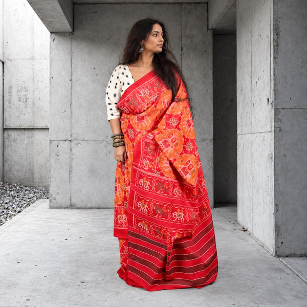 KUNJAR BHAT RASPBERRY RED-APRICOT ORANGE SINGLE IKAT COTTON PATOLA SAREE